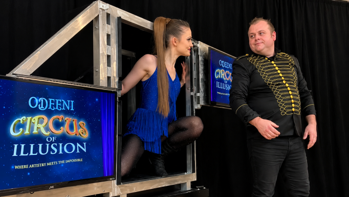 Odeeni Circus of Illusion performing a large stage illusion.